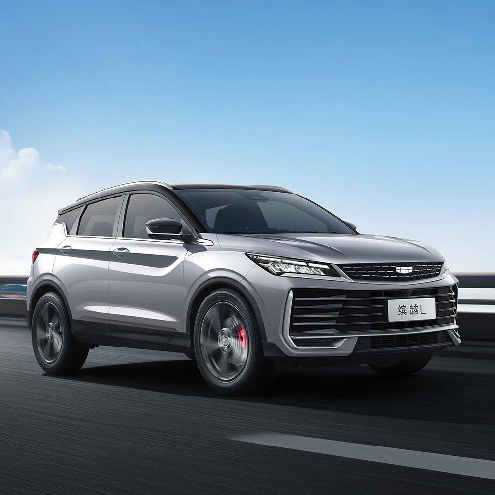 Geely Binyue L 2025 1.5TD DCT Star Glory Edition driving A silver Geely Binyue L SUV driving on a road under a clear blue sky.