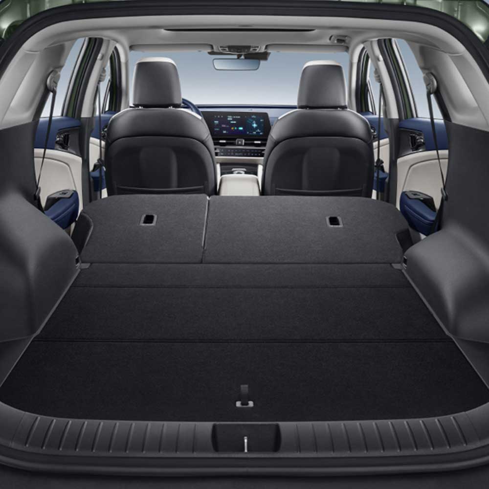 KIA Sportage 2025 1.5T 2WD Premium Intelligent Edition trunk The open trunk of a car, showing a spacious cargo area with folded rear seats.