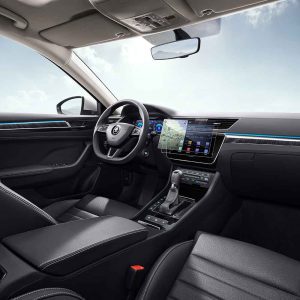 Interior of a Škoda car with a digital dashboard and infotainment screen.