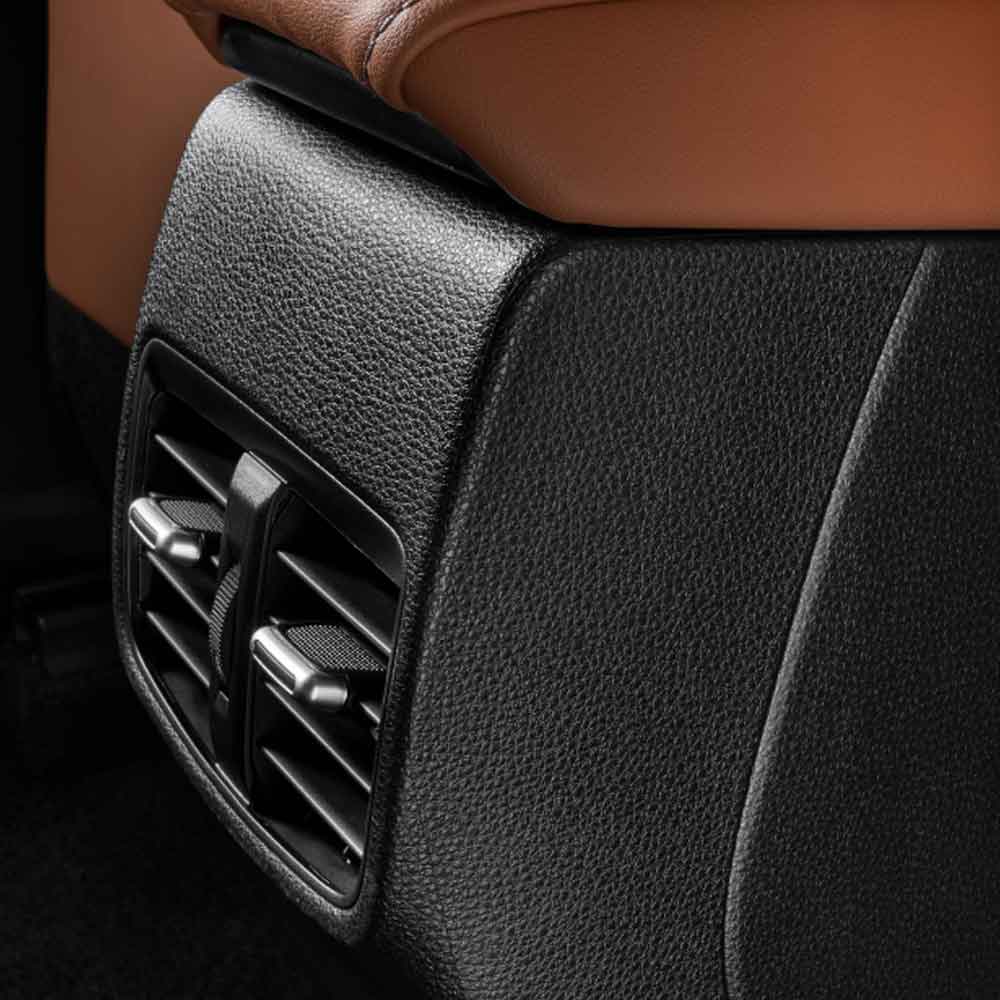 Toyota Corolla 2024 1.2T Elite Rear air vents Close - up of a car's rear air vent with black textured trim and brown leather seat.
