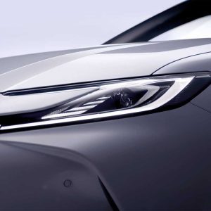 A close - up of a car's sleek headlight.