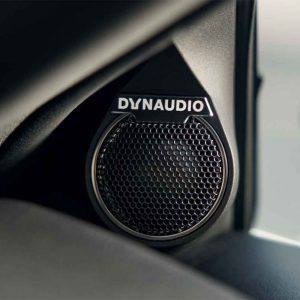 A close - up of a Dynaudio car speaker.