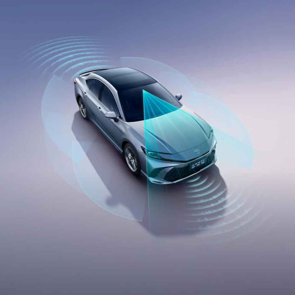 A Toyota car with a detection system visualized by blue waves and beams.