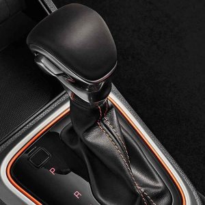 Close - up of a car's gear shift lever.