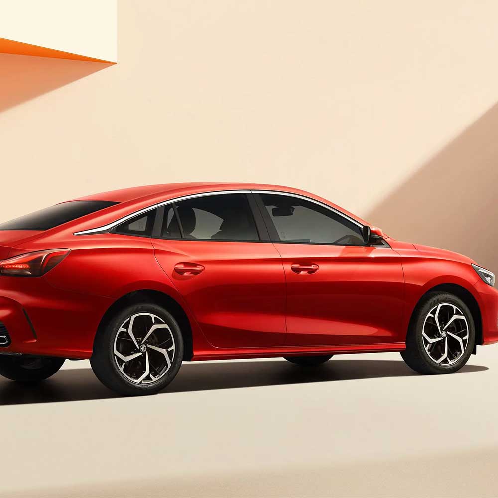 Side view of red sedan with sleek design.