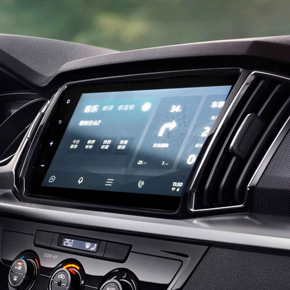 Car's infotainment screen displaying Chinese - language interface with music and radio options.