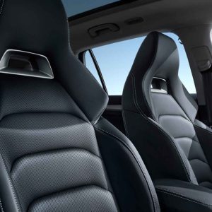 SKODA KODIAQ 2025 TSI330 5-Seater FWD Luxury Edition gallery image seats Close - up of black leather car seats with a clear blue sky visible through the car window.