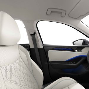 Car interior with white leather seat and blue ambient lighting.