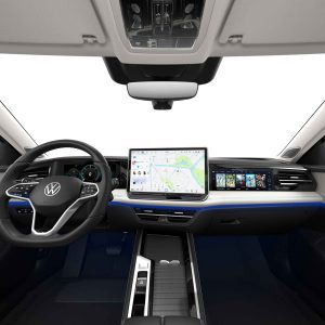 Interior of a Volkswagen car with a steering wheel, a large central touchscreen displaying a map, and a modern dashboard.