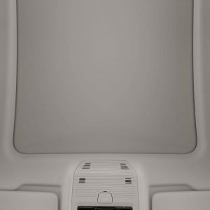 Interior view of a car's ceiling with a sunroof and control panel.