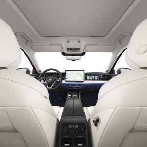 Interior of a Volkswagen car with white leather seats, a central touchscreen display, and a modern dashboard.