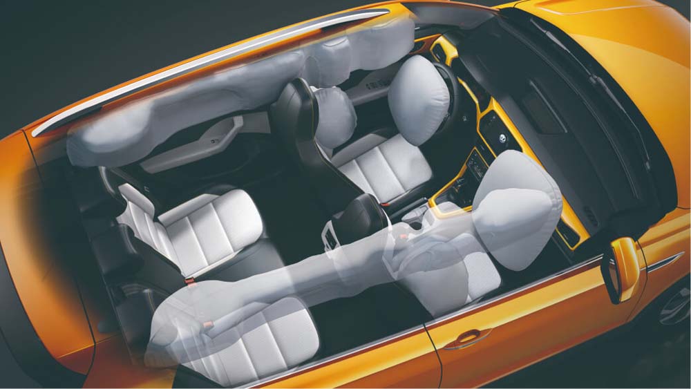 Overhead view of an orange car's interior with deployed airbags.