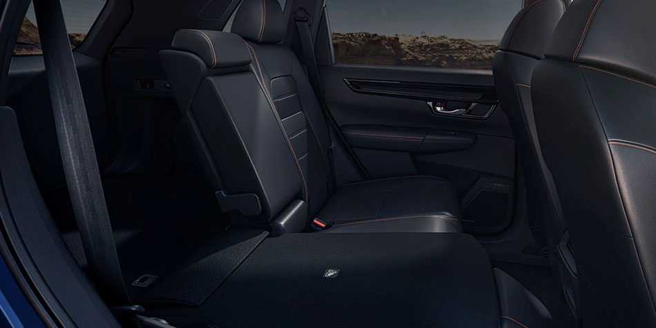 2023 Honda CR-V Black leather trimmed seating with the center console folded down for trunk access