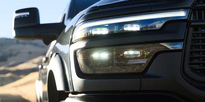 Display The passenger-side headlamp on a dark gray 2026 Ram 2500 Rebel