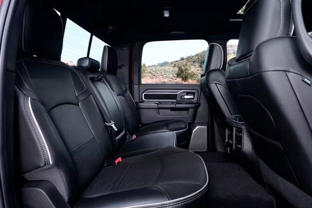 Display The rear seats in a red 2026 Ram 2500 Laramie