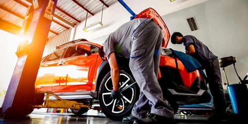 Workers are maintaining cars