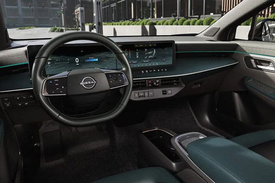 2026 Nissan LEAF side interior view of heated seats, steering wheel, and memory system