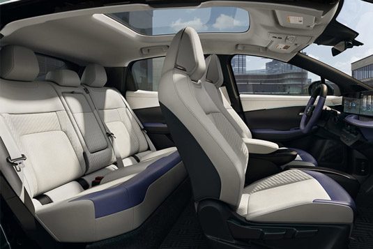 2026 Nissan LEAF side interior view with open doors displaying wide open interior and extra comfort