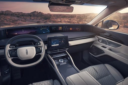 A view of the desert is seen through the windshield of a 2026 Lincoln Black Label Nautilus SUV with the Chalet interior theme