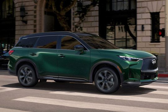 Exterior passenger side profile of 2026 INFINITI QX60 shown in Deep Emerald green color