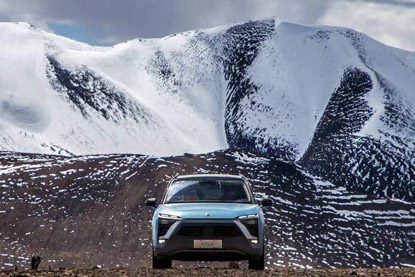 NIO cars at the foot of high-altitude snow-capped mountains