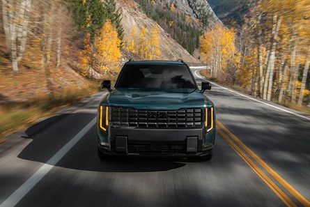 A front-facing view of the 2027 Kia Telluride Hybrid in blue-green
