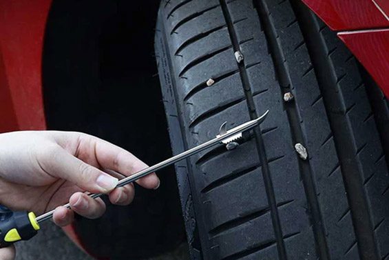 Cleaning foreign objects from tire treads