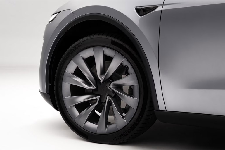 Close-up of the front wheel hub of Tesla Model Y