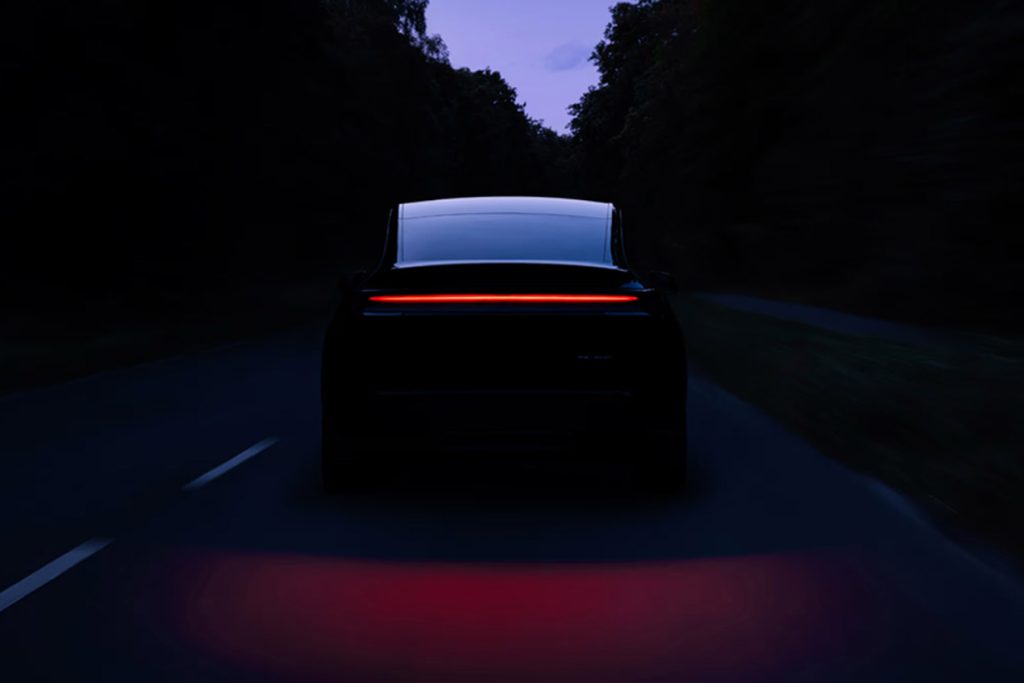 Tesla Model Y with taillights on at night