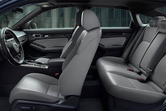 2026 Honda Civic Sedan Sport Touring Hybrid side view of front and rear seats and dashboard