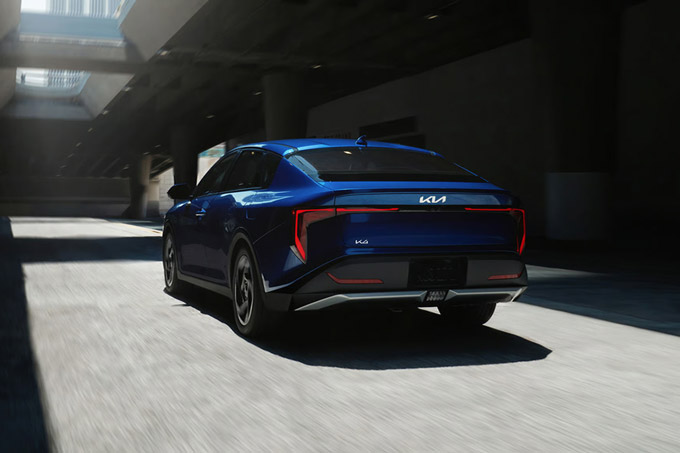 Rear view of the 2026 Kia K4 sedan EX trim in blue