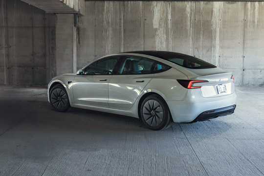 Three-quarter view of the rear of the 2026 Tesla Model 3